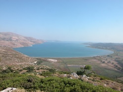 Fig.3: View south towards the Gulf of Livadi. The Livadi marsh (foreground) was the site of the first borehole sites and obtained over 80m of cores through the Holocene bay-fill sediments.